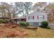 Charming split level home with red door, painted brick and a covered side entrance at 2475 Harvel Nw Dr, Atlanta, GA 30318