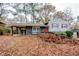Charming split level home with red door, painted brick and a covered side entrance at 2475 Harvel Nw Dr, Atlanta, GA 30318