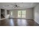Well-lit living room with hardwood floors and lots of natural light from the large front windows at 2475 Harvel Nw Dr, Atlanta, GA 30318