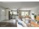 Bright open-concept living and dining area with stainless steel appliances and modern finishes at 2475 Harvel Nw Dr, Atlanta, GA 30318