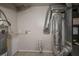 Utility room with water heater, hvac system, and tile flooring at 2475 Harvel Nw Dr, Atlanta, GA 30318