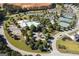 Aerial view showcasing the community amenities: pool, tennis courts, basketball court, playground, walking trails, and community garden at 81 Richmond Way, Villa Rica, GA 30180