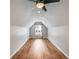 Finished attic space with hardwood floors, window, and ceiling fan at 81 Richmond Way, Villa Rica, GA 30180