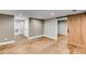 Finished basement features luxury vinyl plank flooring and barn door at 81 Richmond Way, Villa Rica, GA 30180