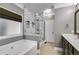 Bathroom featuring a soaking tub and a tiled glass-enclosed shower at 81 Richmond Way, Villa Rica, GA 30180