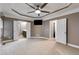 Expansive bedroom with neutral walls, carpet, and multiple doorways, including access to the bathroom at 81 Richmond Way, Villa Rica, GA 30180