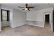 Bedroom with carpet, a modern ceiling fan, and a window with sheer curtains at 81 Richmond Way, Villa Rica, GA 30180