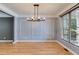 Dining room features modern lighting and a bright window at 81 Richmond Way, Villa Rica, GA 30180