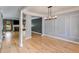 Elegant dining room with hardwood floors, decorative molding, and modern lighting at 81 Richmond Way, Villa Rica, GA 30180