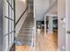 Welcoming foyer with hardwood floors, staircase, and views into living spaces at 81 Richmond Way, Villa Rica, GA 30180