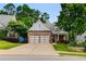 Beautiful brick-and-siding home with well-manicured landscaping, and a two-car garage at 81 Richmond Way, Villa Rica, GA 30180