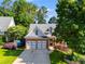 Charming brick-and-siding home with well-manicured landscaping, and a two-car garage at 81 Richmond Way, Villa Rica, GA 30180