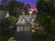 A two-story house with a two-car garage and manicured landscaping at 81 Richmond Way, Villa Rica, GA 30180