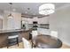 Kitchen with stainless steel appliances, pendant lighting, and kitchen table at 81 Richmond Way, Villa Rica, GA 30180