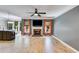 Open-concept living area with fireplace, hardwood floors, and lots of natural light at 81 Richmond Way, Villa Rica, GA 30180