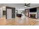 Spacious open-concept living area features a fireplace and views of the kitchen at 81 Richmond Way, Villa Rica, GA 30180