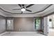 Main bedroom featuring a ceiling fan, two windows, and neutral paint at 81 Richmond Way, Villa Rica, GA 30180
