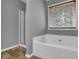 Relaxing bathroom featuring a large soaking tub and separate shower at 1649 Southgate Mill Nw Dr, Duluth, GA 30096