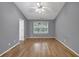 Bedroom featuring a window, neutral walls, and hardwood flooring at 1649 Southgate Mill Nw Dr, Duluth, GA 30096