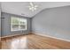 Bright bedroom with hardwood floors and large window to let in lots of light at 1649 Southgate Mill Nw Dr, Duluth, GA 30096