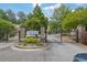 Gated entrance to The Gates at Crestwood community featuring brick pillars and manicured landscaping at 1649 Southgate Mill Nw Dr, Duluth, GA 30096