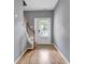 Entryway with hardwood floors and staircase with wooden rails at 1649 Southgate Mill Nw Dr, Duluth, GA 30096