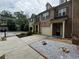 Lovely townhome with attached garage, landscaped yard, and inviting entrance at 1649 Southgate Mill Nw Dr, Duluth, GA 30096