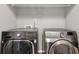 Laundry room featuring modern LG and Samsung washer and dryer at 1649 Southgate Mill Nw Dr, Duluth, GA 30096