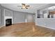 Bright living room featuring hardwood floors, fireplace, and an open layout at 1649 Southgate Mill Nw Dr, Duluth, GA 30096