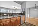 Open kitchen and living area with stainless appliances, stone countertops, and hardwood floors at 1649 Southgate Mill Nw Dr, Duluth, GA 30096