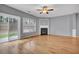 Bright living room with hardwood floors, fireplace and sliding glass doors to the backyard at 1649 Southgate Mill Nw Dr, Duluth, GA 30096