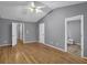 This spacious main bedroom features a vaulted ceiling, hardwood floors, and an en-suite bathroom at 1649 Southgate Mill Nw Dr, Duluth, GA 30096