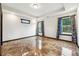 Bedroom featuring glossy marble floors, neutral paint color and natural light from the windows at 2711 Mcdonough Rd, Hampton, GA 30228