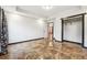 Spacious bedroom featuring glossy marble floors, neutral paint color, tray ceiling, and closet at 2711 Mcdonough Rd, Hampton, GA 30228