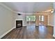 Spacious living room featuring a cozy fireplace and sliding doors to a sunroom at 4120 Buckley Woods Dr, Norcross, GA 30093
