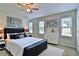 Nicely staged primary bedroom with neutral walls, area rug, and contemporary furnishings at 4120 Buckley Woods Dr, Norcross, GA 30093