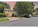 Exterior shot of the home on a quiet street with trees and landscaping at 4120 Buckley Woods Dr, Norcross, GA 30093
