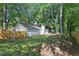 Backyard with a fenced yard, patio and view of mature trees at 971 Clover Ln, Lawrenceville, GA 30044
