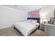 Comfortable bedroom with plush carpet, and a full bed with pink bedding at 971 Clover Ln, Lawrenceville, GA 30044