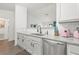 Bright kitchen with granite countertops, subway tile backsplash, and stainless steel appliances at 971 Clover Ln, Lawrenceville, GA 30044