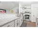Modern kitchen with granite countertops, subway tile backsplash, and stainless steel appliances at 971 Clover Ln, Lawrenceville, GA 30044