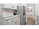 Kitchen featuring stainless steel appliances, granite countertops, and white cabinets at 971 Clover Ln, Lawrenceville, GA 30044