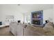Bright living room featuring a cozy fireplace, large couch, and a neutral color palette at 971 Clover Ln, Lawrenceville, GA 30044
