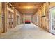 Unfinished basement offers potential for customization with exposed framing and walkout access at 1121 Vinings Grove Se Way, Smyrna, GA 30082