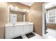 Bathroom featuring a double vanity and large mirror with great lighting at 1121 Vinings Grove Se Way, Smyrna, GA 30082