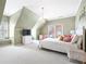 Cozy bedroom features neutral carpet, a reading nook, and ample natural light at 1121 Vinings Grove Se Way, Smyrna, GA 30082