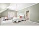 Bright bedroom features an ensuite bathroom, neutral carpet, and ample natural light at 1121 Vinings Grove Se Way, Smyrna, GA 30082