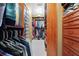 Walk-in closet with built-in shelving and drawers to provide ample storage at 1121 Vinings Grove Se Way, Smyrna, GA 30082