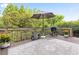 Wooden deck with outdoor kitchen, patio umbrella, and mature trees at 1121 Vinings Grove Se Way, Smyrna, GA 30082