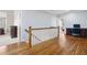 Upstairs landing with hardwood floors, a railing, and desk nook at 1121 Vinings Grove Se Way, Smyrna, GA 30082